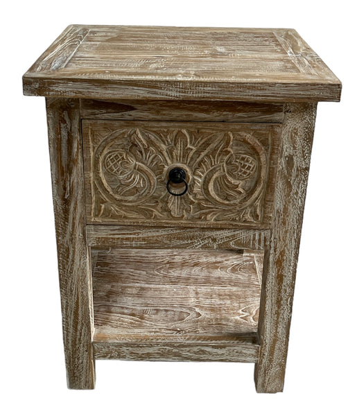 A Teak wood white washed bedside table with one drawer and bottom shelf, featuring floral patterns on the drawer front.